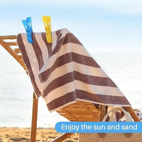 Colorful XXL clothespin holding striped towel on beach chair, 7AGAT plastic clothes peg for sunbeds, pool, laundry, and heavy towels