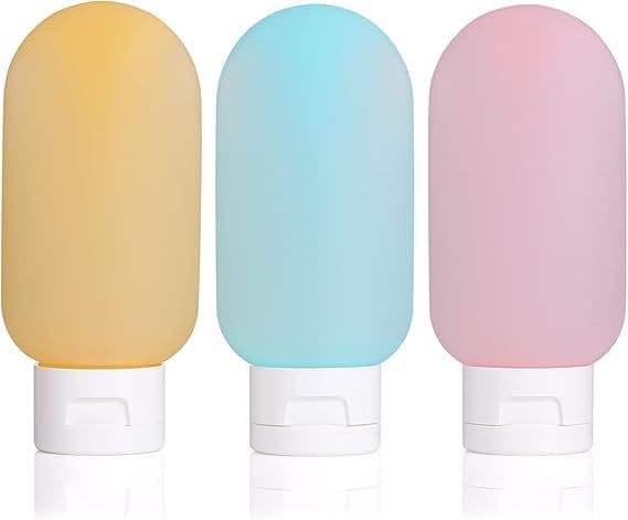 Set of three 60ml refillable travel bottles for toiletries, made by 7AGAT, perfect for skin care and travel convenience.