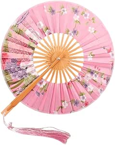 Traditional red folding hand fan with floral pattern, 27 cm, displayed on decorative wooden stand, ideal for weddings and dance.