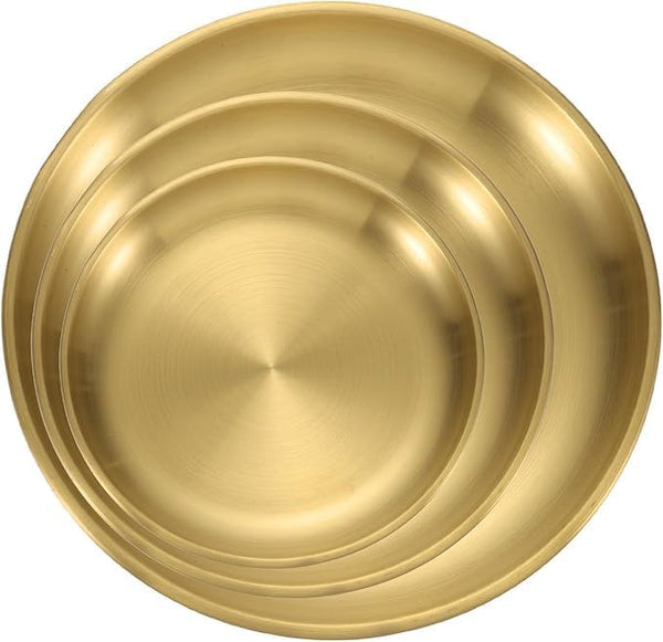 Set of three gold stainless steel round serving plates in different sizes, ideal for kitchen, restaurant, salad, dessert, or outdoor use.