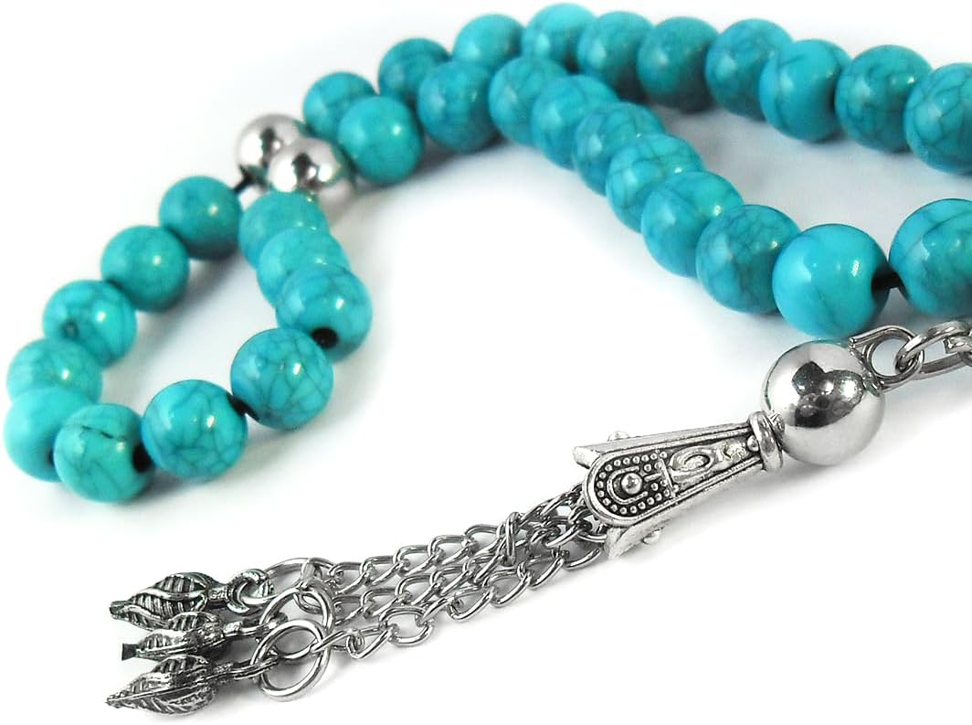 Handmade rosary by 7AGAT with fayrouz clerk beads and metal separators, displayed in a gift bag for meditation and positivity.