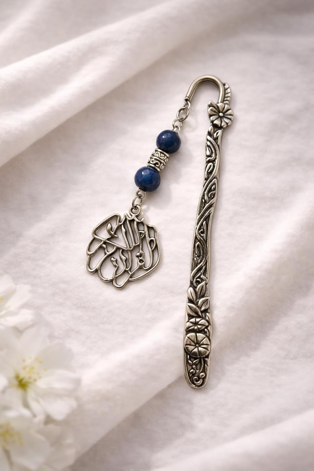 Islamic gift box by 7AGAT with prayer rug, Quran, prayer beads, musk bottle, keychain, and miswak stick, ideal for Ramadan.
