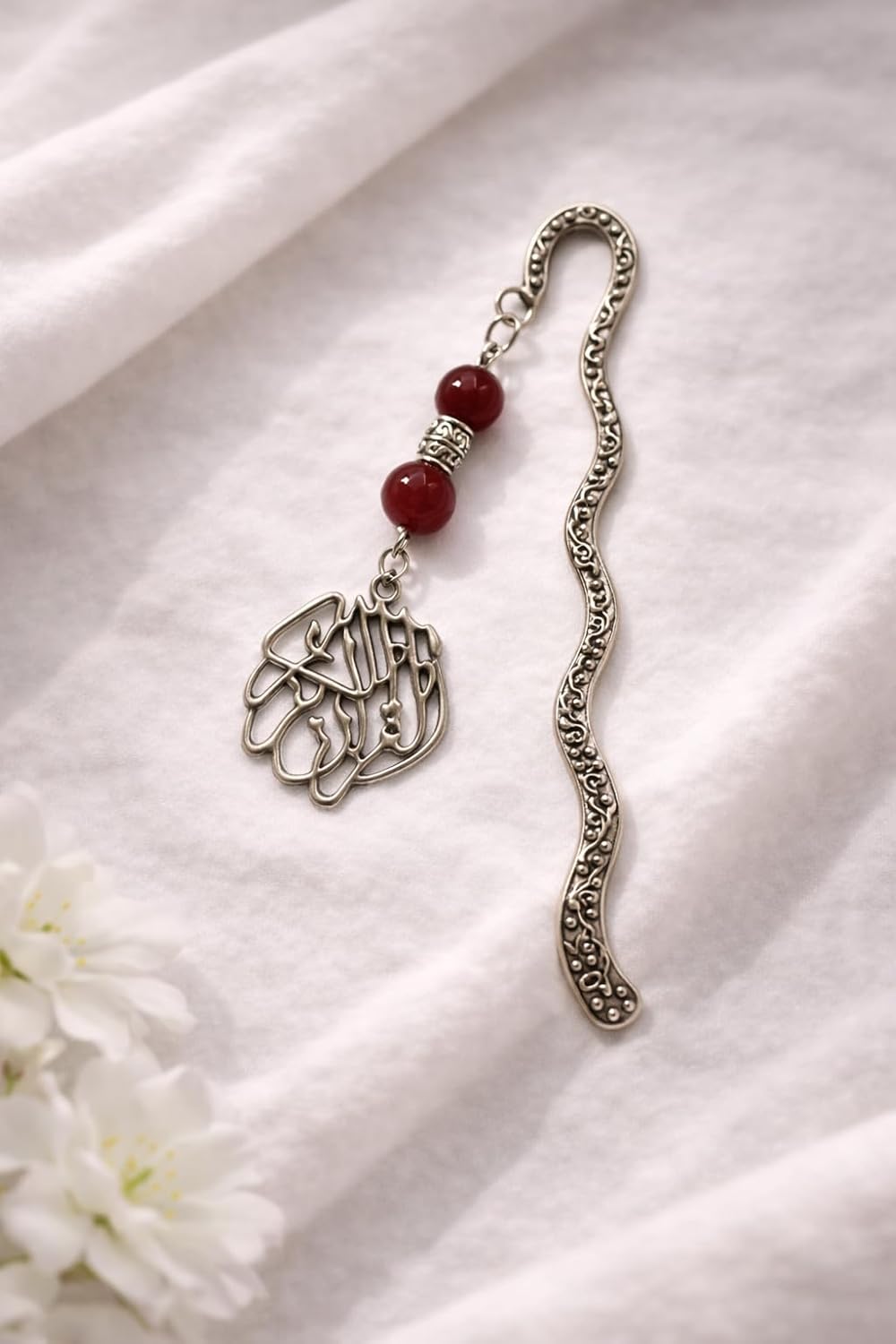 Islamic gift box by 7AGAT with prayer rug, Quran, prayer beads, musk, keychain, and miswak stick for Ramadan celebration.