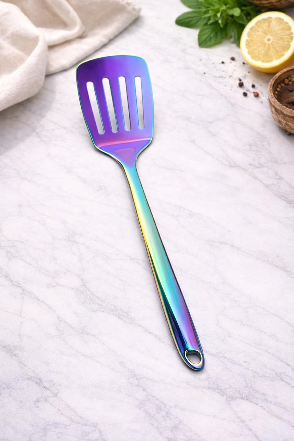 7AGAT stainless steel kitchen utensil with ergonomic handle, heat and rust-resistant, dishwasher safe, in silver, gold, or rainbow finish.