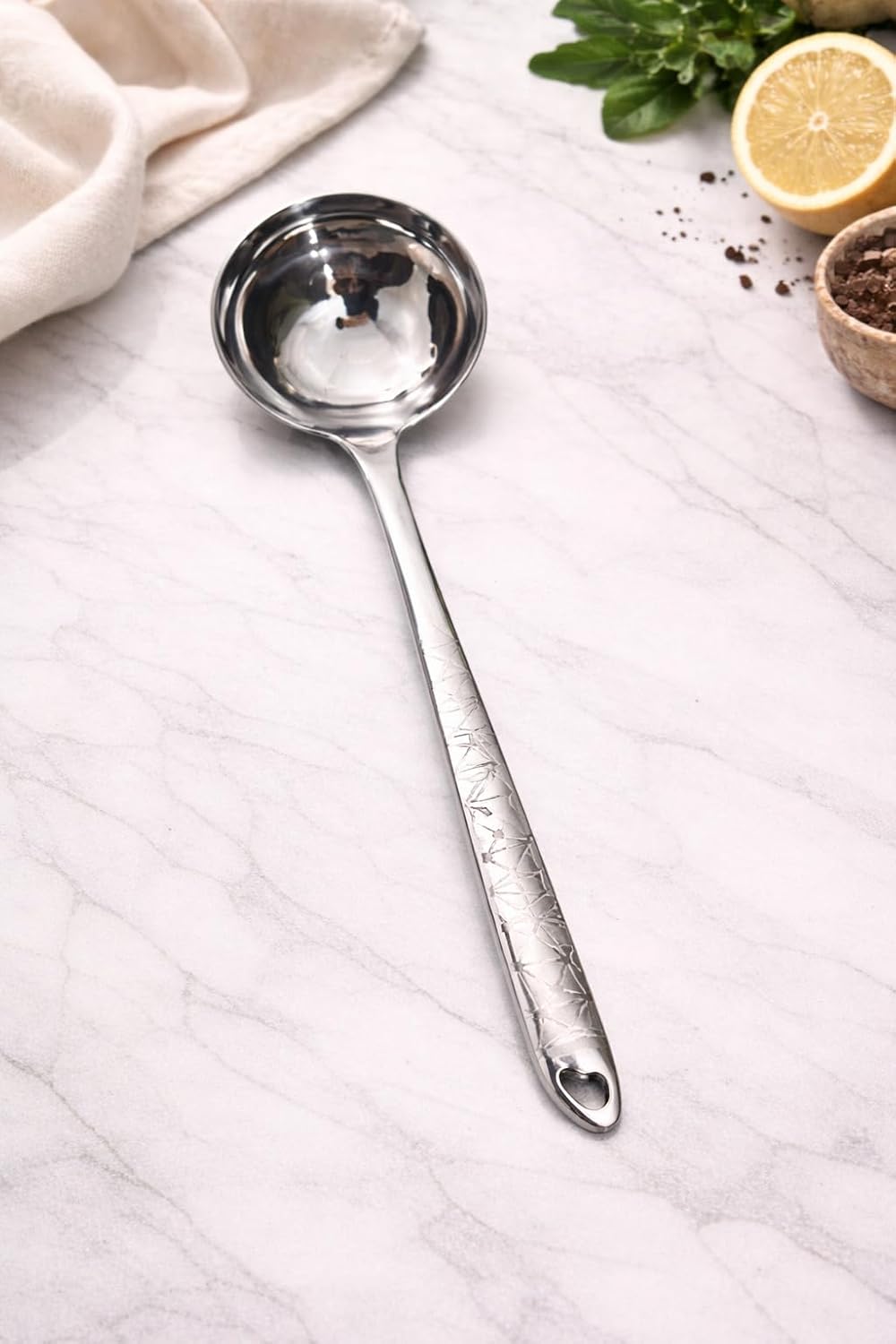 7AGAT stainless steel kitchen utensil with ergonomic handle, heat and rust-resistant, dishwasher safe, in silver, gold, and rainbow finishes.