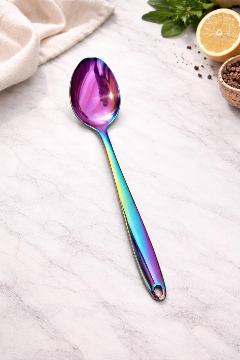 7AGAT stainless steel kitchen utensil with ergonomic handle, heat and rust-resistant, dishwasher safe, in silver, gold, and rainbow finishes.