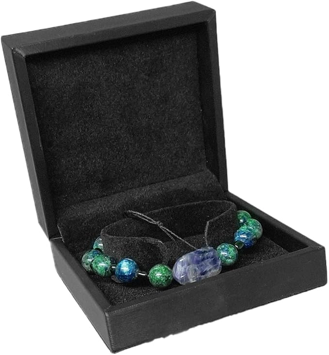 Black leather velvet jewelry box by 7AGAT with compartments for bracelets, necklaces, rings, and watches.