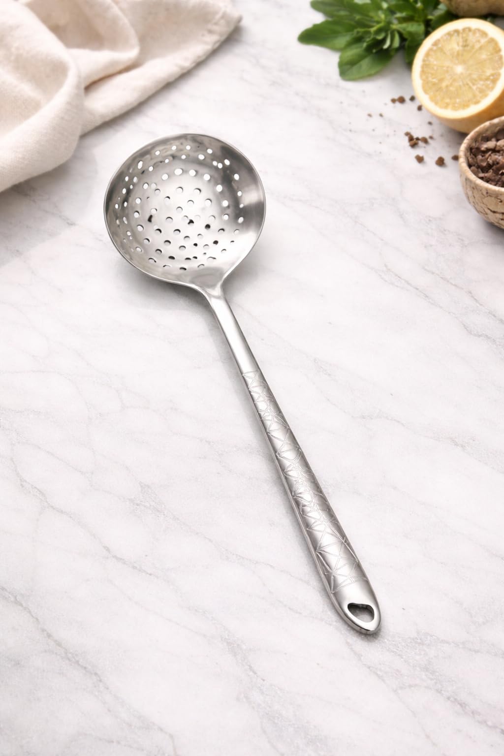 7AGAT stainless steel kitchen utensil with ergonomic handle, heat and rust-resistant, dishwasher safe, in silver, gold, and rainbow finishes.