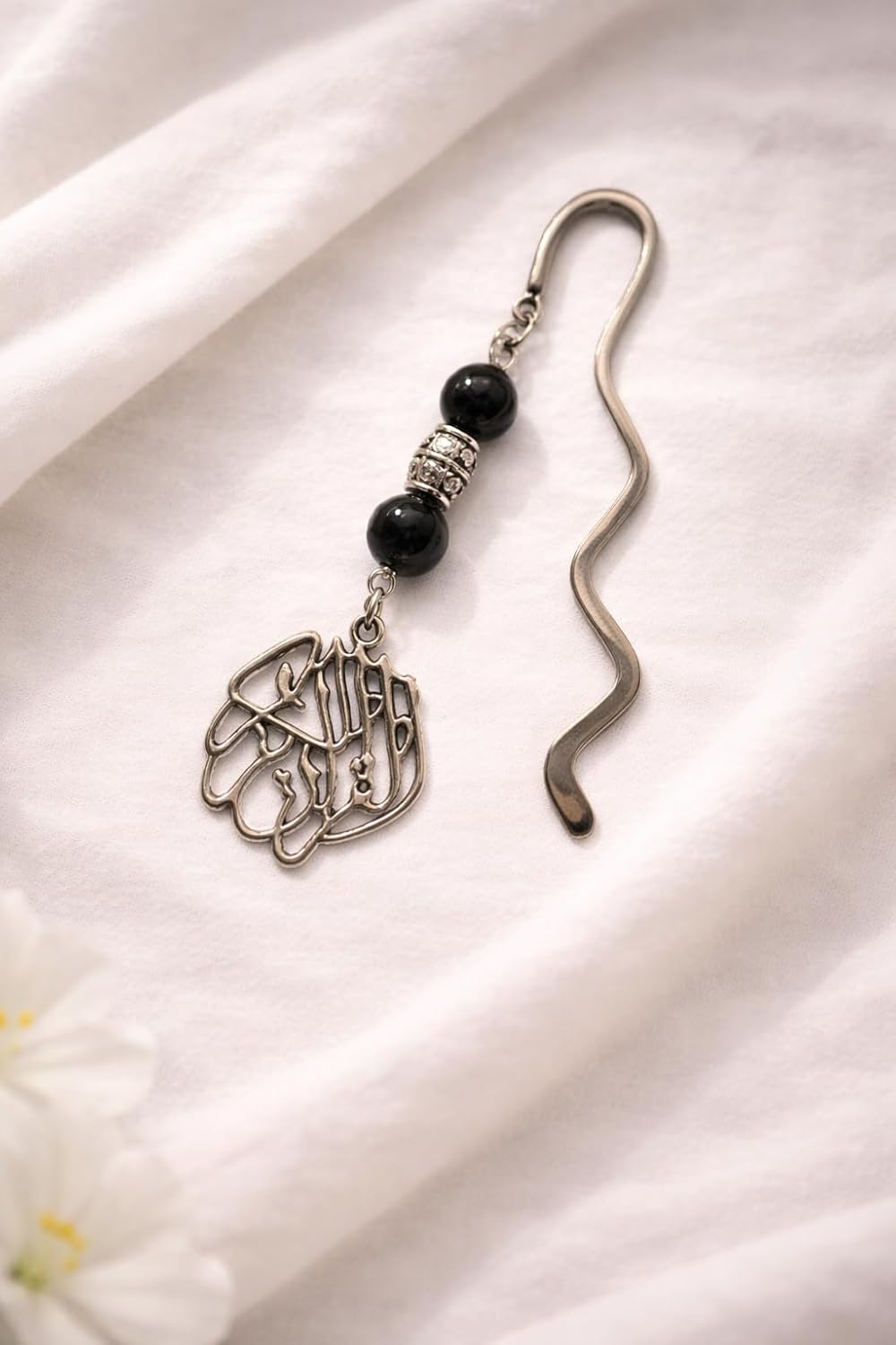 Islamic gift box by 7AGAT with prayer rug, Quran, prayer beads, musk, keychain, and miswak for Ramadan gifts.