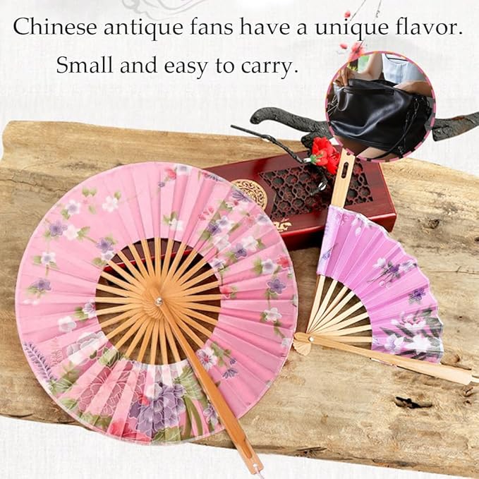 Traditional round folding hand fan by 7AGAT in vibrant red with floral pattern, displayed with decorative wooden stand.