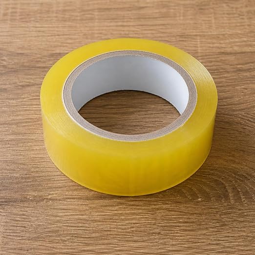Clear transparent packing tape roll by 7AGAT with strong adhesive, ideal for sealing boxes and durable shipping packaging.