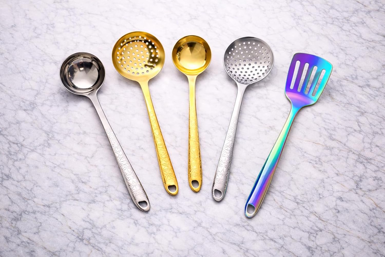 7AGAT stainless steel kitchen utensil with ergonomic handle, heat and rust-resistant, dishwasher safe in silver, gold, and rainbow finishes.