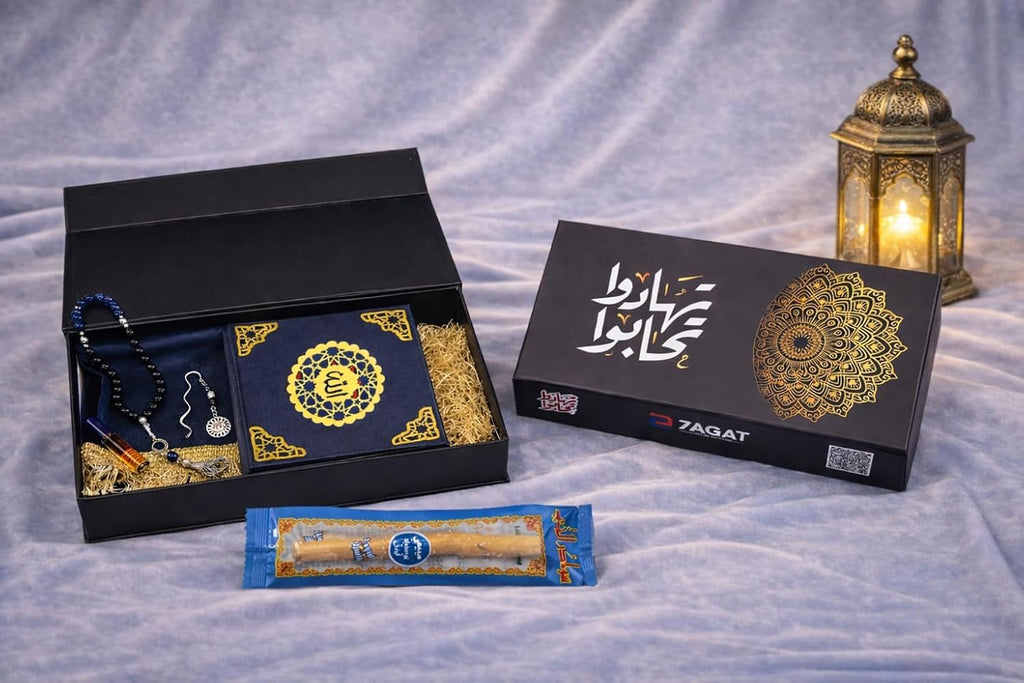 Islamic gift box by 7AGAT with prayer rug, Quran, prayer beads, musk, keychain, and miswak for Ramadan celebrations.
