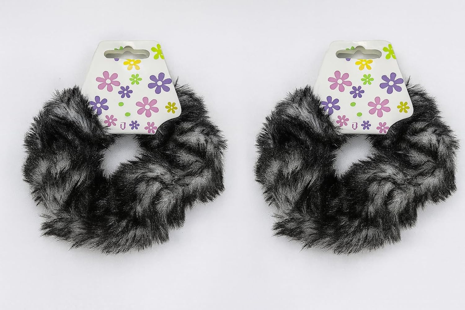 Two colorful faux fur ponytail holders by 7AGAT, soft and fluffy, designed for women and girls to style hair easily.