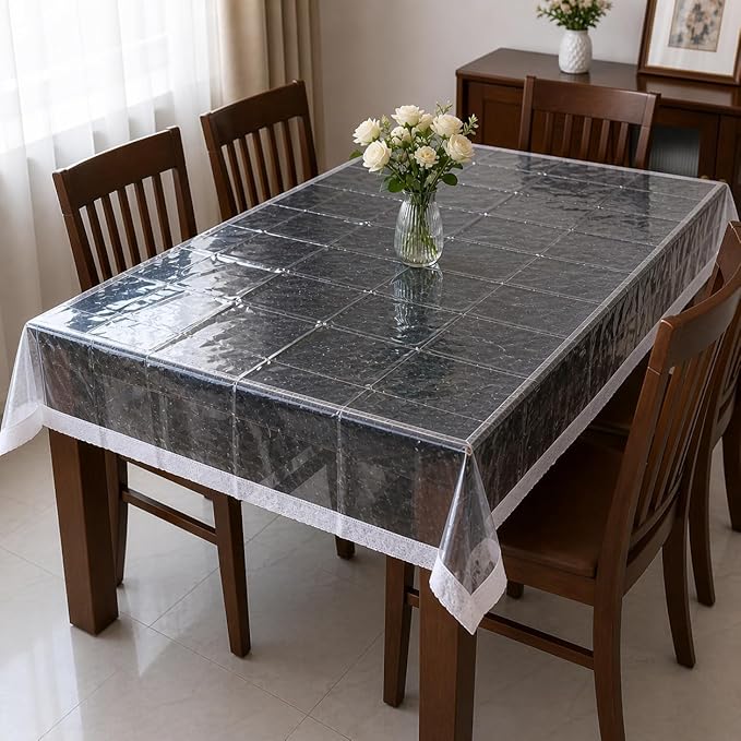 Transparent PVC table cover with lace edges from 7AGAT, waterproof and easy to clean, ideal for protecting dining tables.