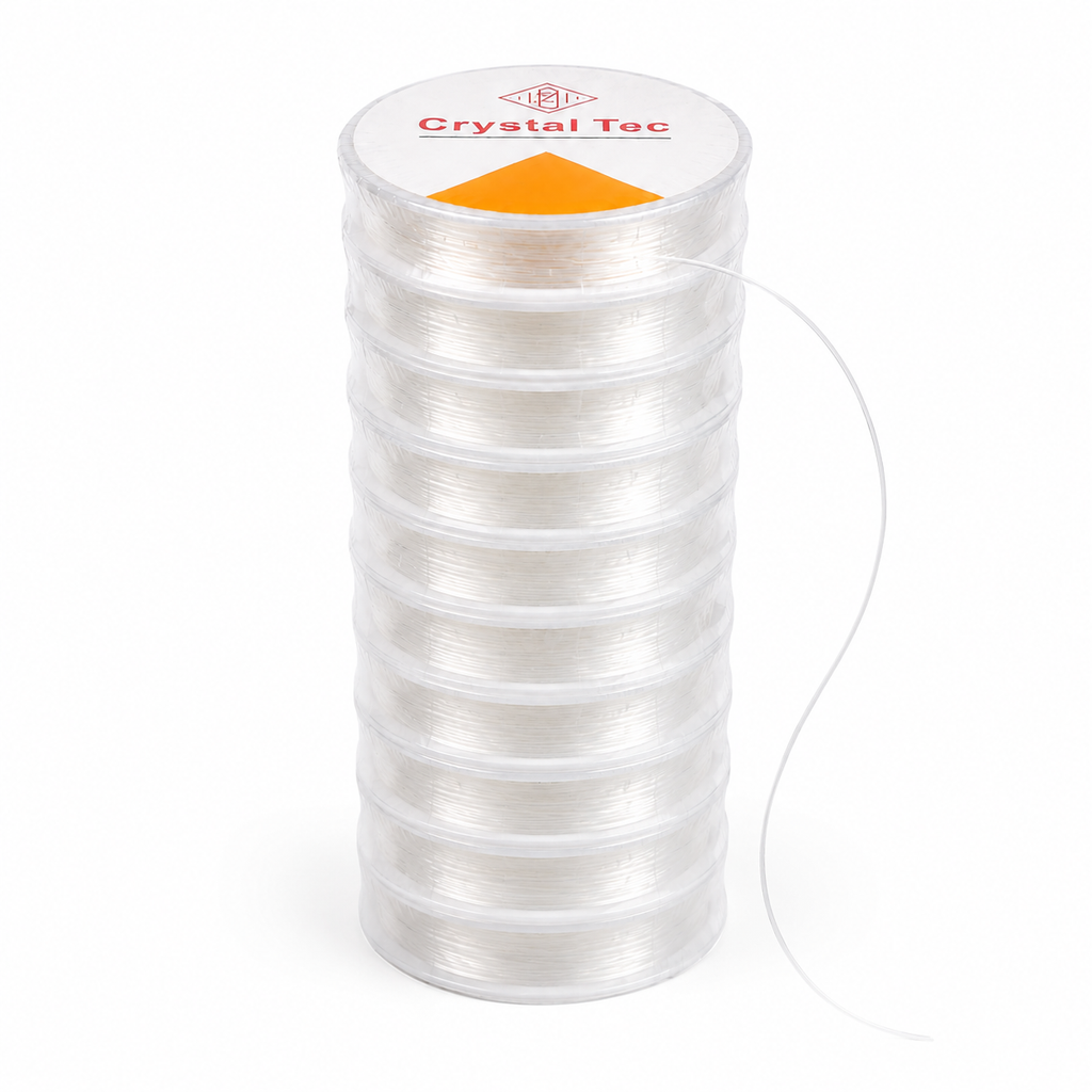 A spool of clear crystal thread wound on a clear plastic core, with a white top label reading 'Crystal Tec' and an orange triangle, shown on a white background.
