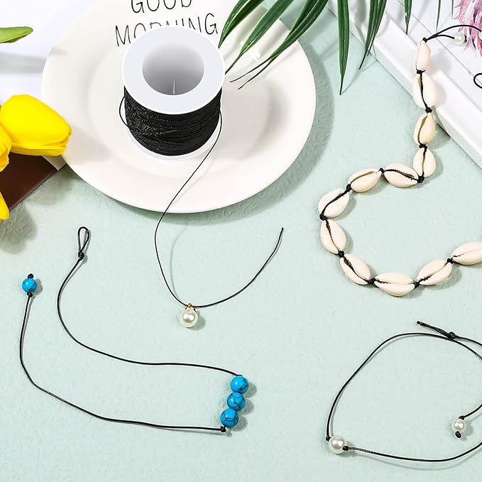 Necklaces with beads on a light blue surface with a 'Good Morning' sign.