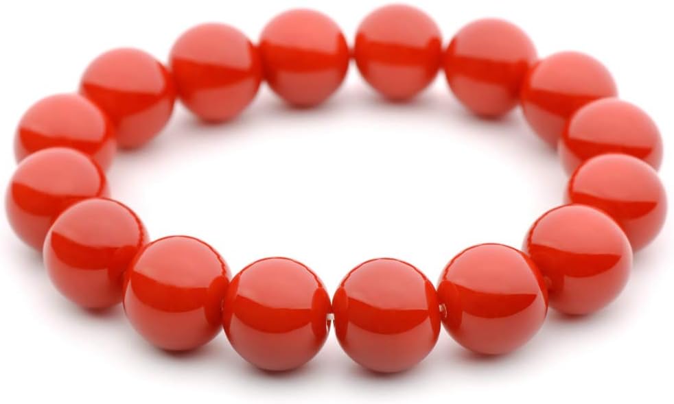 A beaded stretch bracelet made of glossy, polished red round beads, shown on a plain white background.