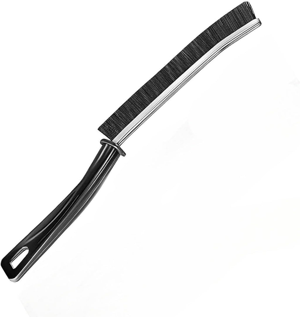 A black-handled cleaning brush with black bristles and a silver metal core, shown diagonally on a plain white background.