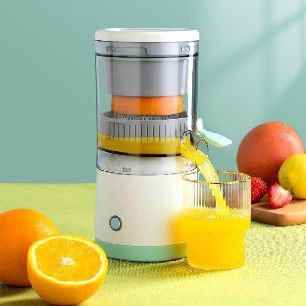 Juicer with oranges and a glass of juice on a green background