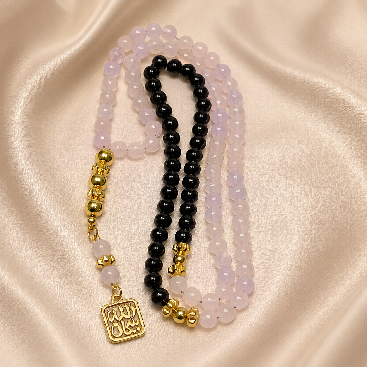 Handmade 7AGAT rosary with 99 natural rose quartz beads, gold tassel, separators, and intricate craftsmanship for prayer and meditation.