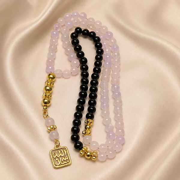 Handmade 7AGAT rosary with 99 natural rose quartz beads, gold tassel, separators, and intricate craftsmanship for prayer and meditation.