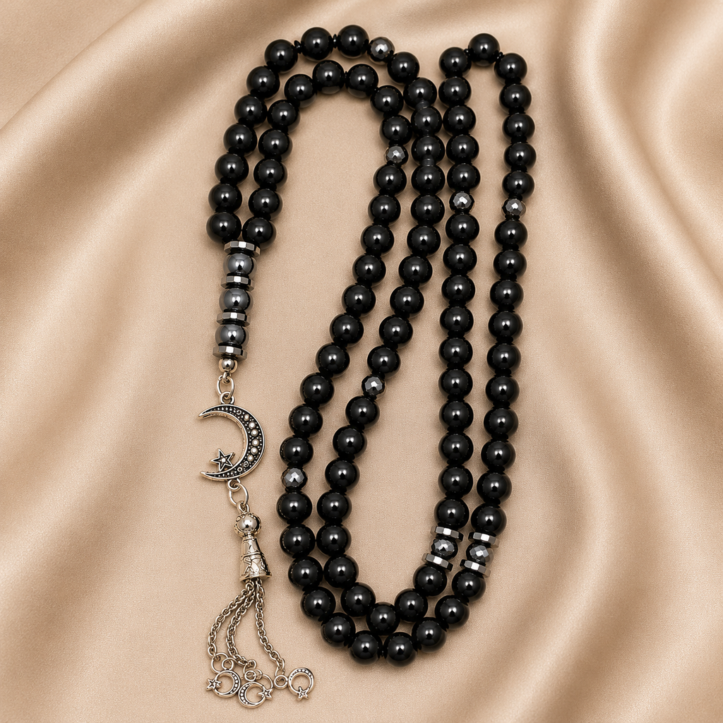 Handmade 8mm black hematite prayer beads rosary with silver separators and metal closure, displayed with a gift pouch.