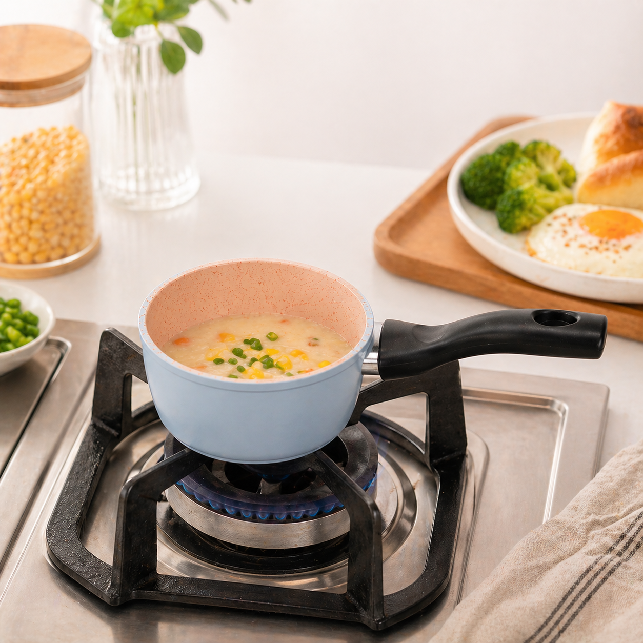 Stainless steel saucepan with heat-resistant handle and granite non-stick coating, ideal for cooking sauces and boiling.
