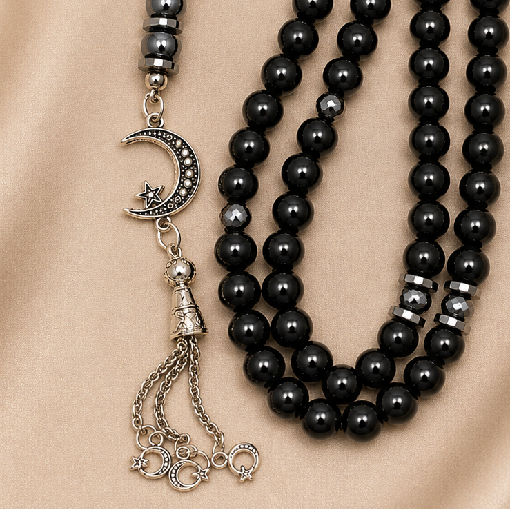 Handmade 8mm black hematite prayer beads rosary with silver separator and metal closure, displayed with gift pouch.