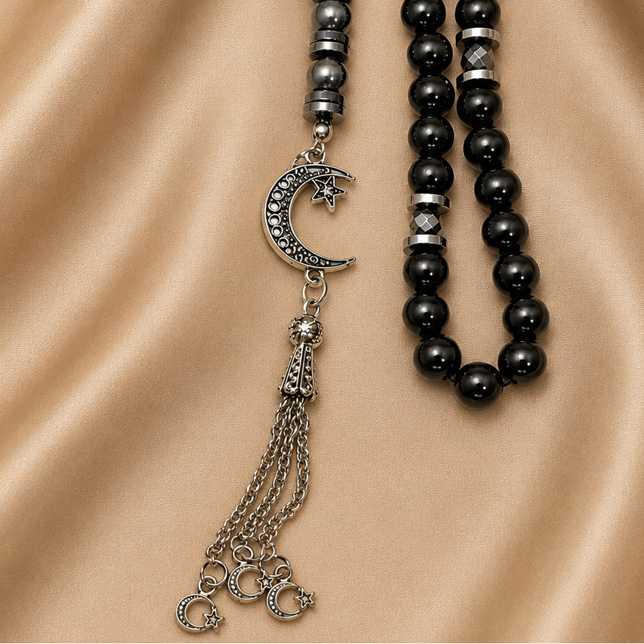 Handmade 8mm black hematite prayer beads rosary with silver separators and metal closure, displayed with a gift pouch.