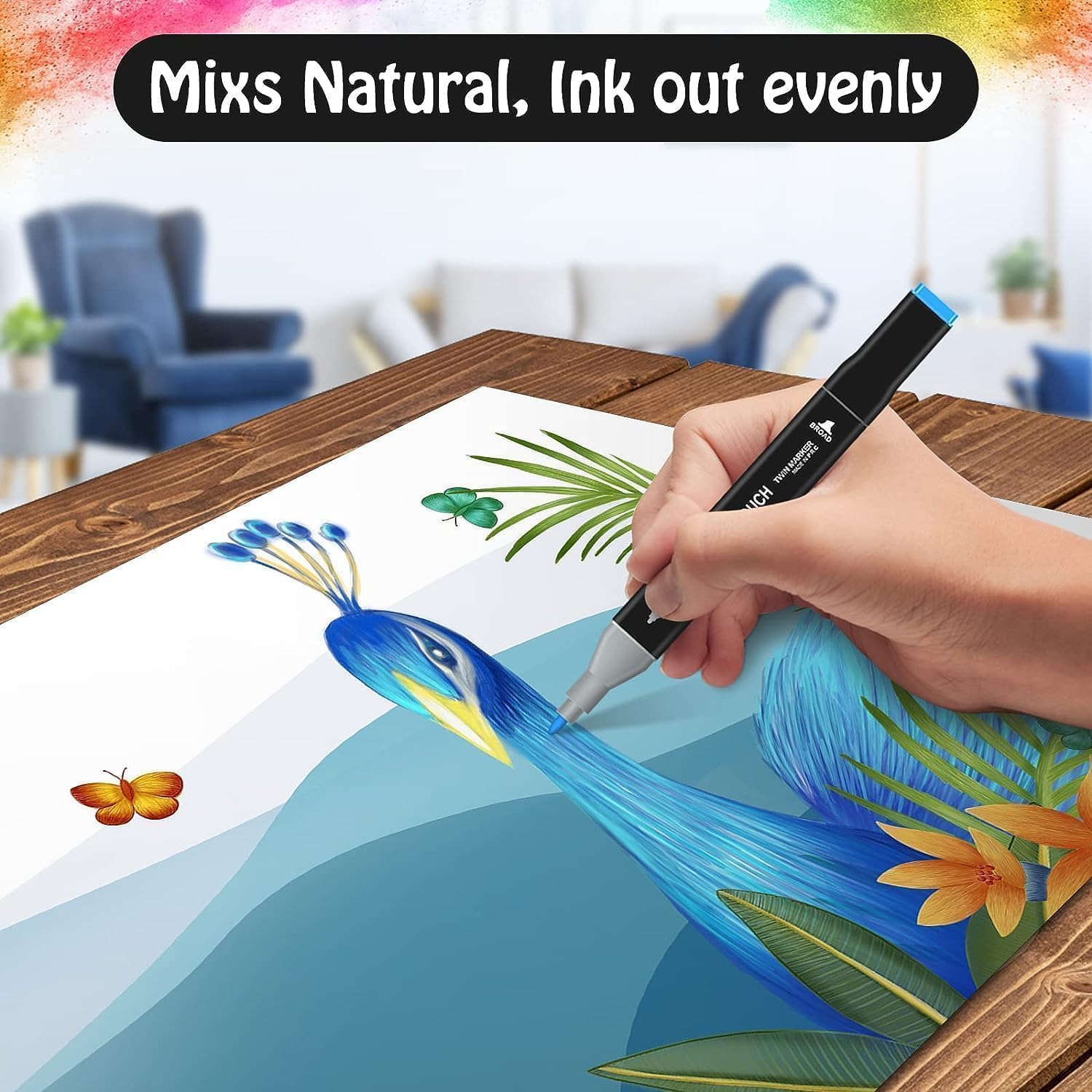 Hand holding a marker over a drawing of a peacock on a table with a colorful background.