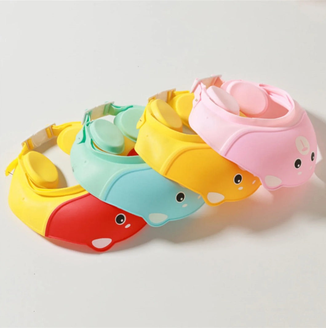 Adjustable multi-color silicone baby shower cap with earmuff protection, waterproof bath visor for kids, designed to prevent tears during bath.