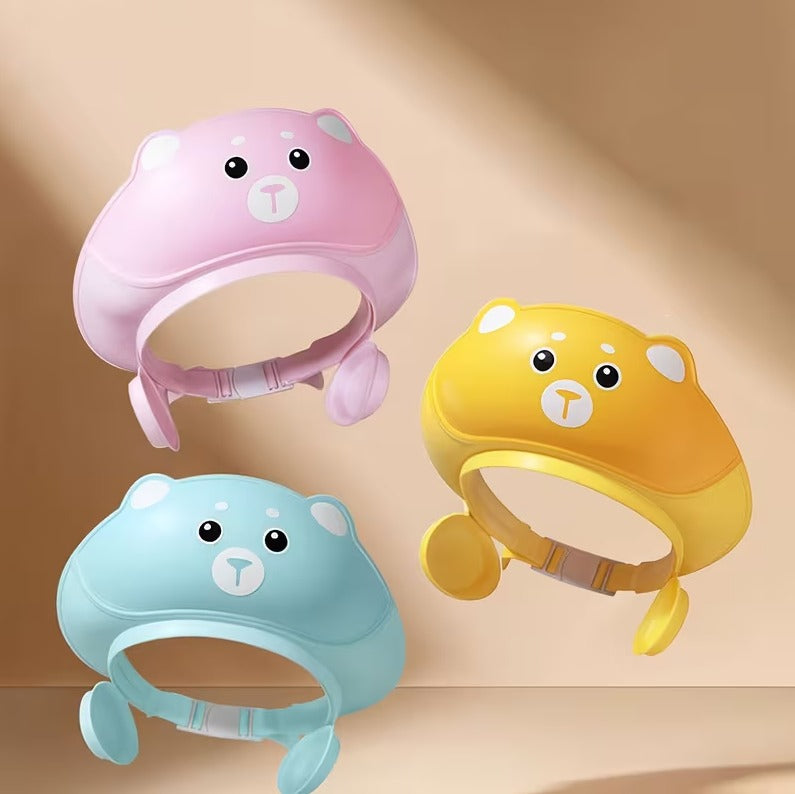 Colorful adjustable silicone baby shampoo cap with earmuff protection, waterproof shower hat for kids' bath time.