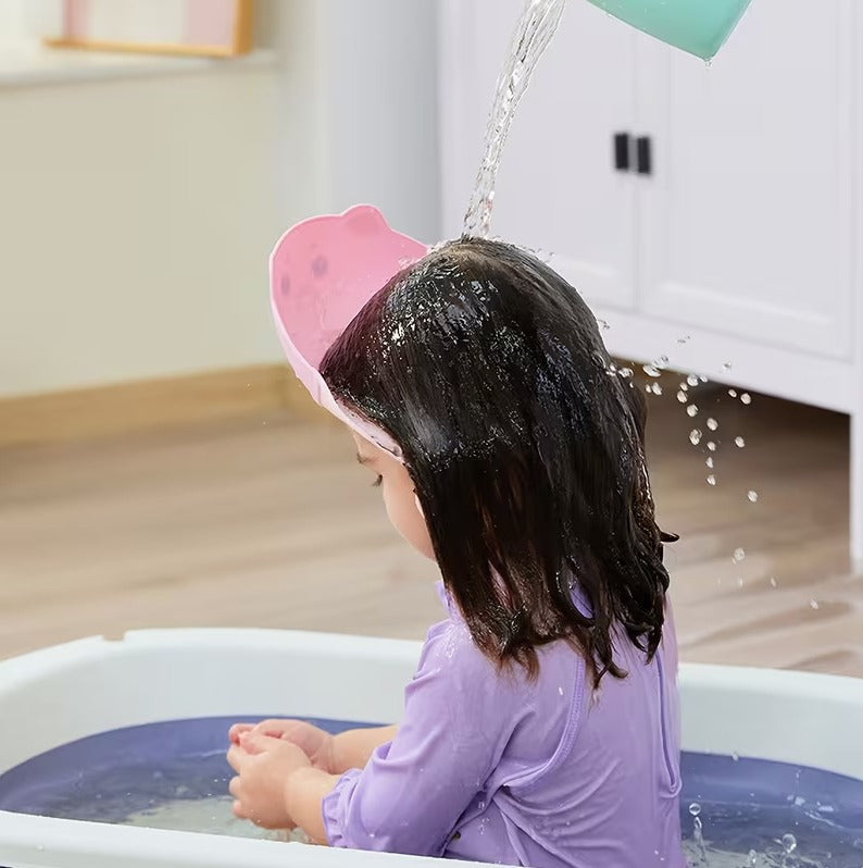 Colorful adjustable silicone baby shampoo cap with ear protection, waterproof bath visor for kids, tear-free shower hat by 7AGAT.