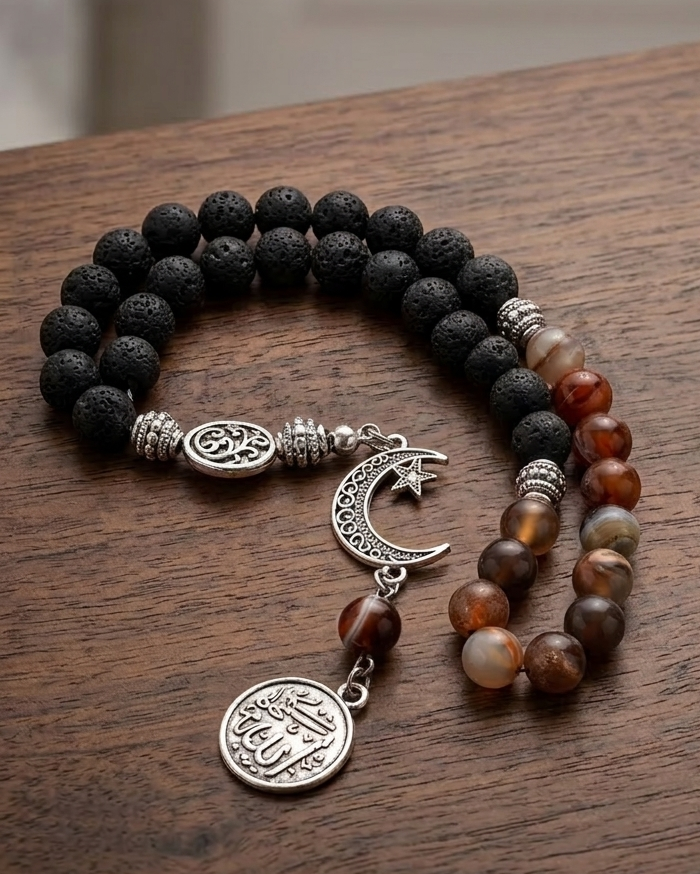 Beaded bracelet with charms on a wooden surface