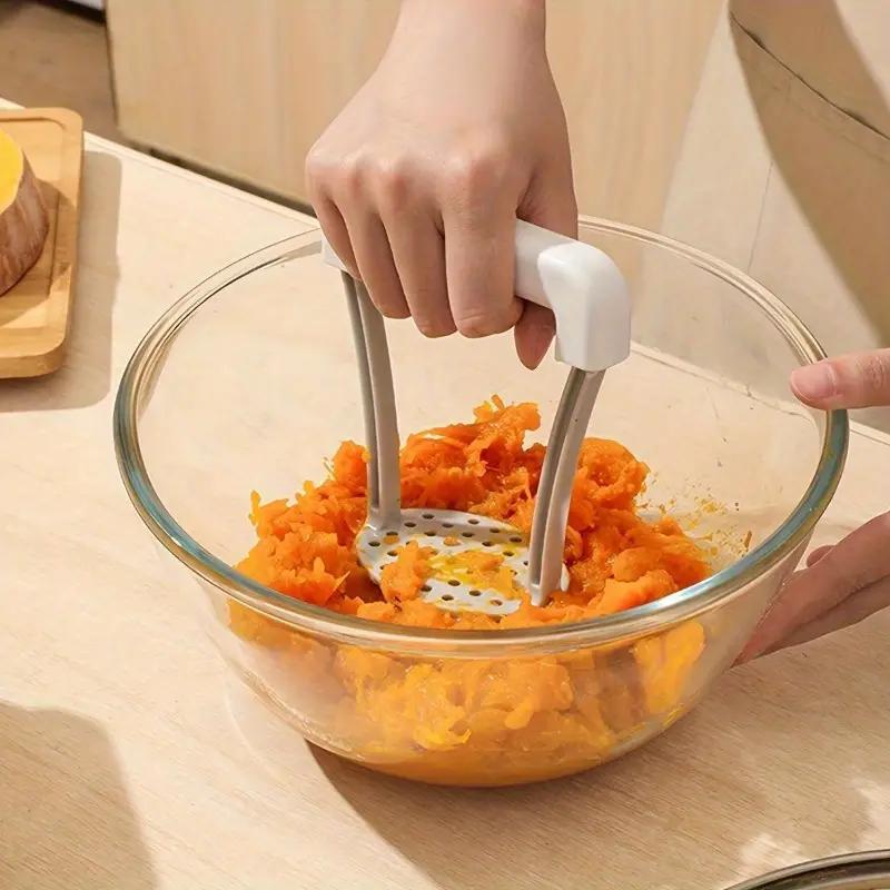 7AGAT manual potato masher with plastic handle, ideal for mashing potatoes, vegetables, and fruits in cooking utensils.