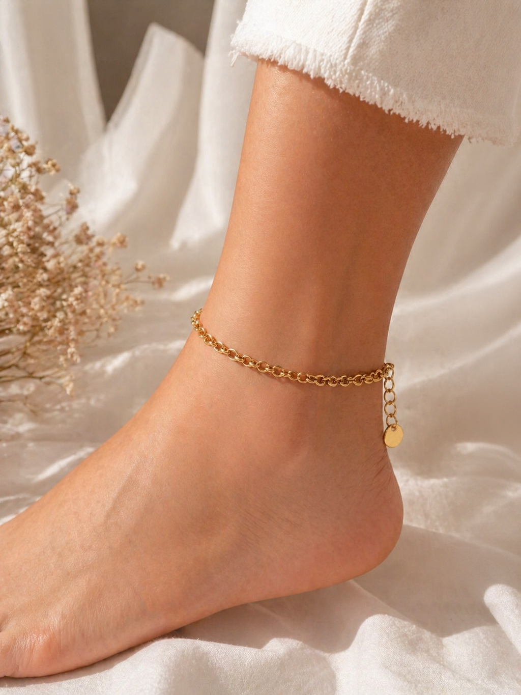 Gold stainless steel anklet for women with adjustable lobster clasp, modern jewelry style, lightweight and tarnish-resistant.